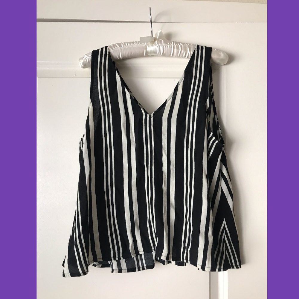 Black and white striped and sleeveless blouse